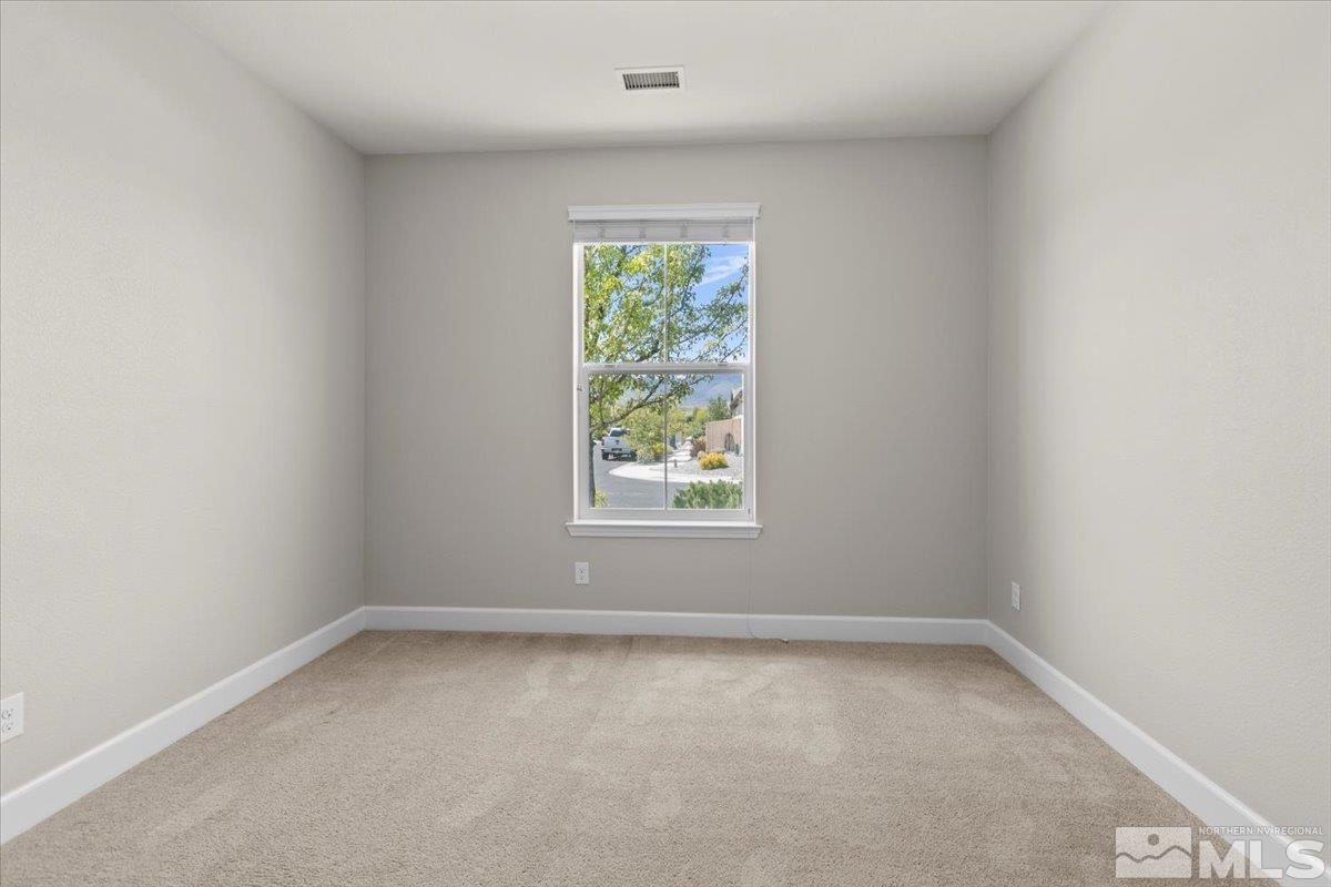 10098 Ignacio Circle Reno, NV 89521 - Photo 24 of 40 an empty room with a window