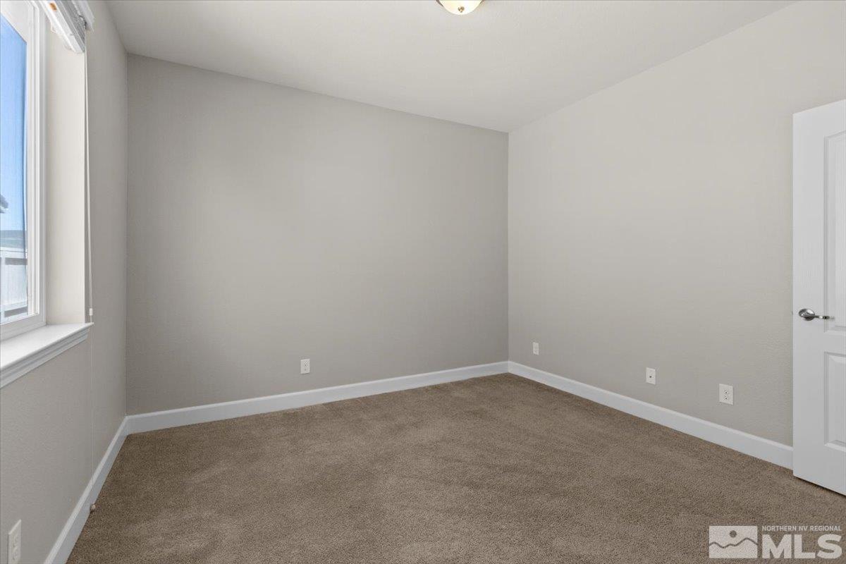 10098 Ignacio Circle Reno, NV 89521 - Photo 26 of 40 an empty room with a window