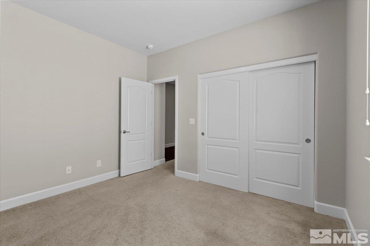 10098 Ignacio Circle Reno, NV 89521 - Photo 27 of 40 an empty room with closet area