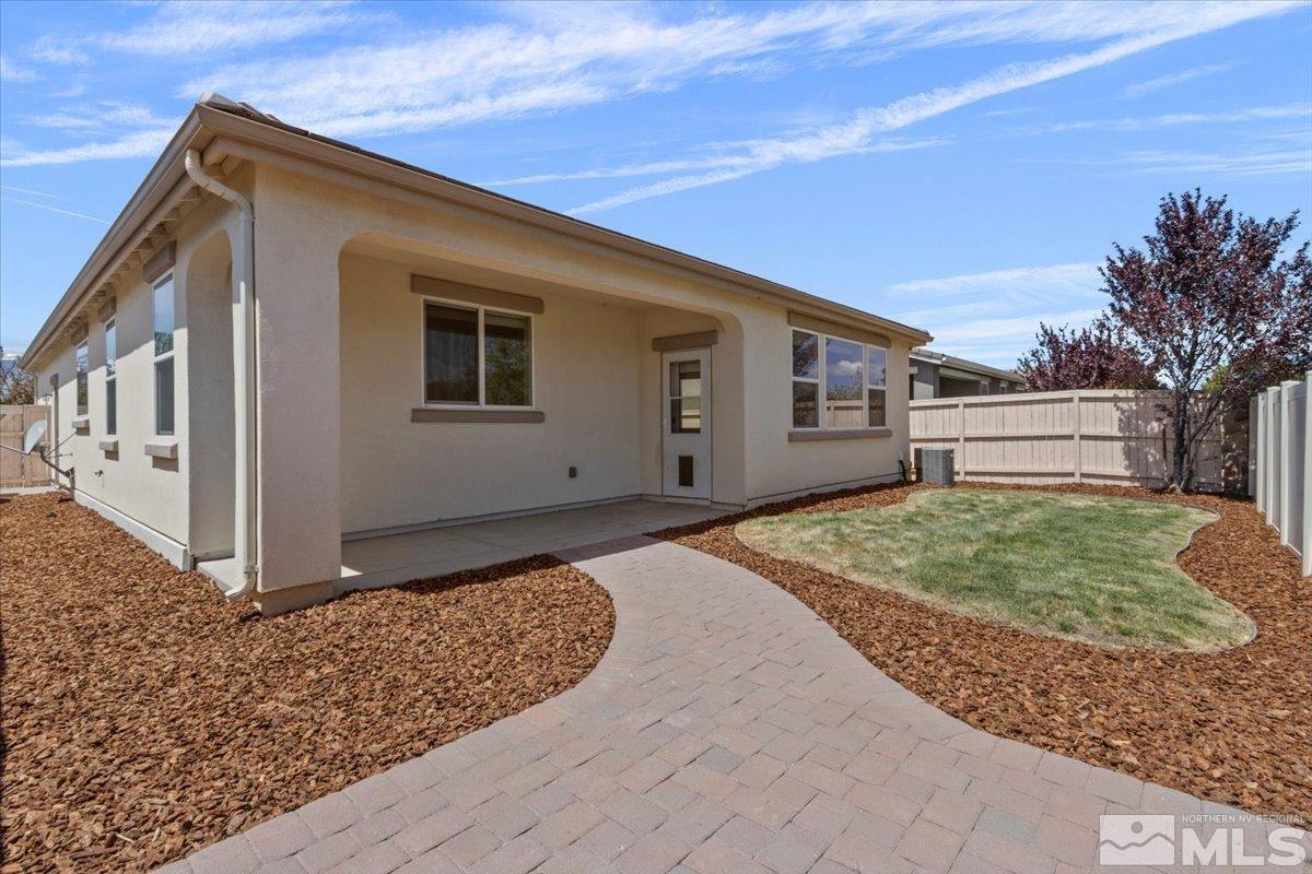 10098 Ignacio Circle Reno, NV 89521 - Photo 31 of 40 a front view of a house with a yard