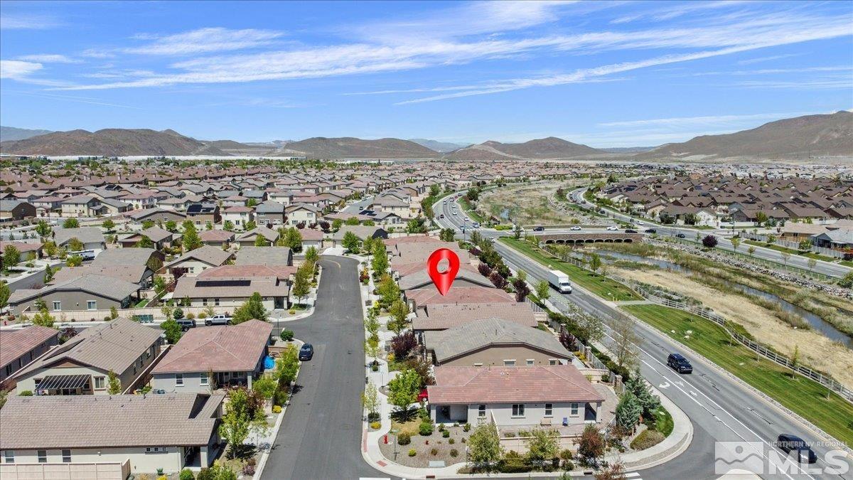 10098 Ignacio Circle Reno, NV 89521 - Photo 38 of 40 an aerial view of residential houses with outdoor space and a building