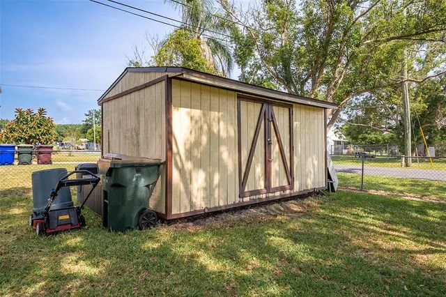 a view of backyard with tub and trees