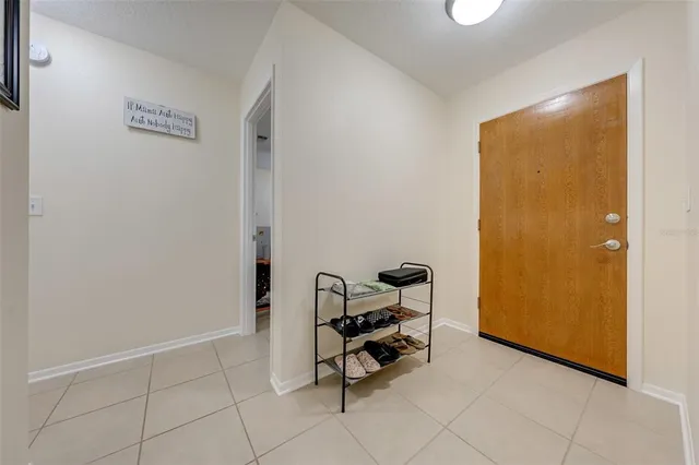a view of a room with table and a chair