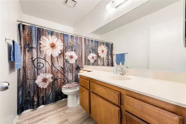 a bedroom with a bed and a desk