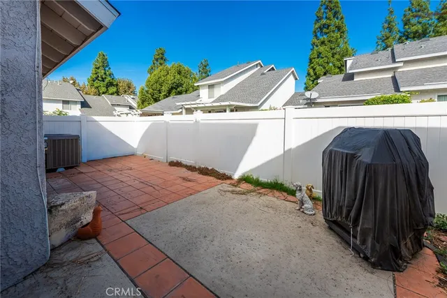 a garden with trees in the background
