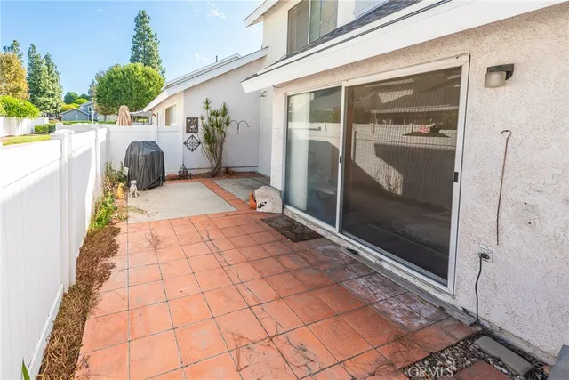 an aerial view of a house with a yard basket ball court and outdoor seating