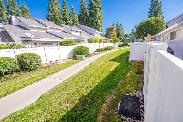 an aerial view of a house with a yard and outdoor seating