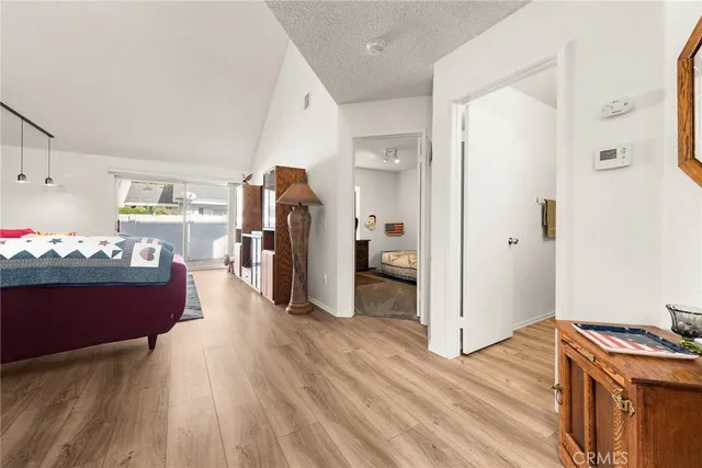 a view of a kitchen and wooden floor
