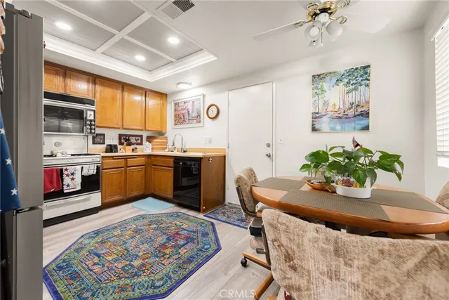 a kitchen with a sink cabinets and window