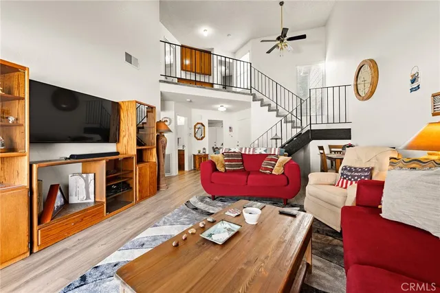 a bathroom with a sink a toilet and a shower curtain