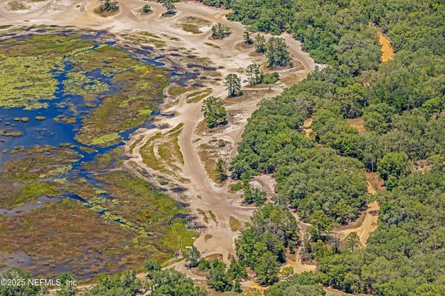 a aerial view of a house with a yard