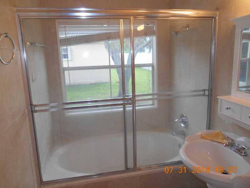 926 Falling Water Road Weston, FL 33326 - Photo 16 of 24 a bathroom with a shower