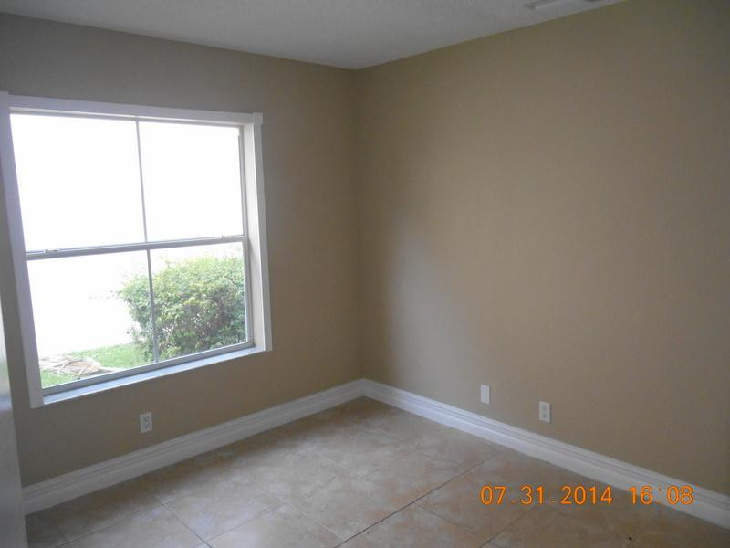 926 Falling Water Road Weston, FL 33326 - Photo 21 of 24 an empty room with a window