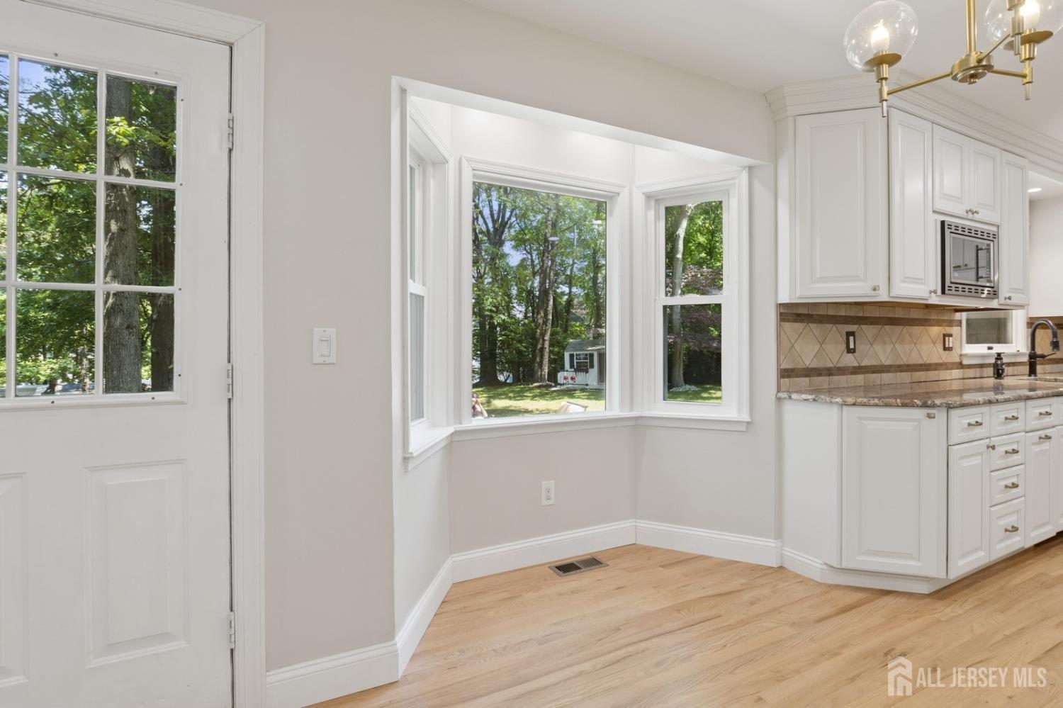 3 Cedar Lane Milltown, NJ 08850 - Photo 11 of 67 a view of kitchen with granite countertop cabinets and window