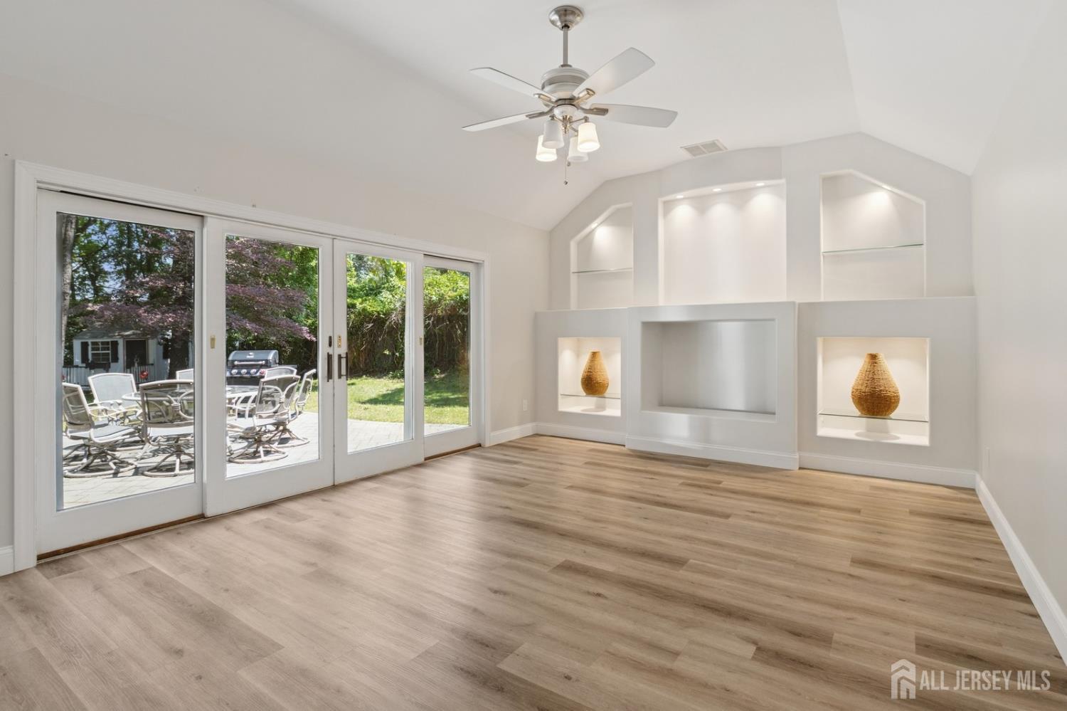 3 Cedar Lane Milltown, NJ 08850 - Photo 17 of 67 a view of an empty room with window wooden floor and front door