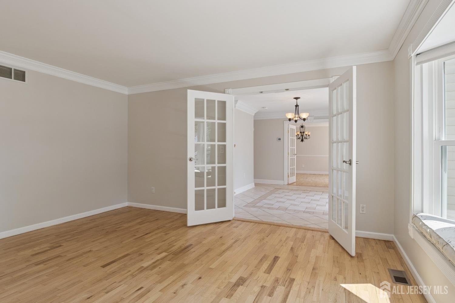 3 Cedar Lane Milltown, NJ 08850 - Photo 23 of 67 wooden floor in an empty room with a window