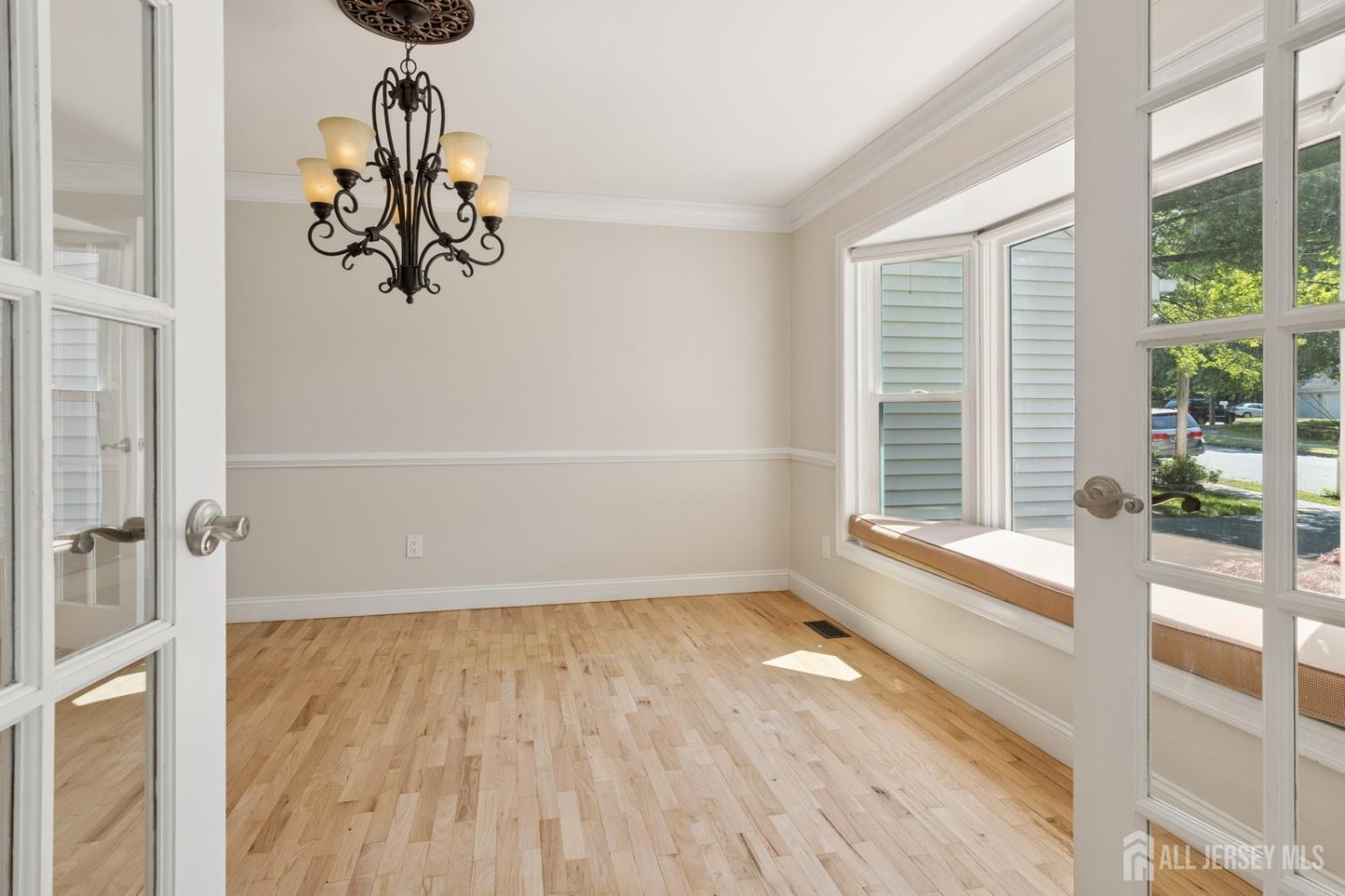 3 Cedar Lane Milltown, NJ 08850 - Photo 24 of 67 a view of a room with a large window wooden floor and front door