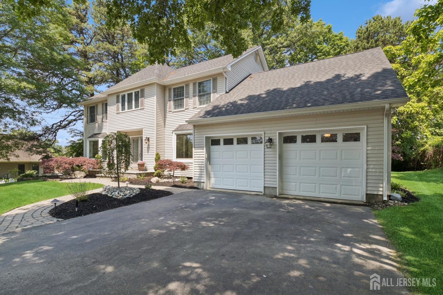 3 Cedar Lane Milltown, NJ 08850 - Photo 3 of 67 a view of a white house with a large space and a large tree