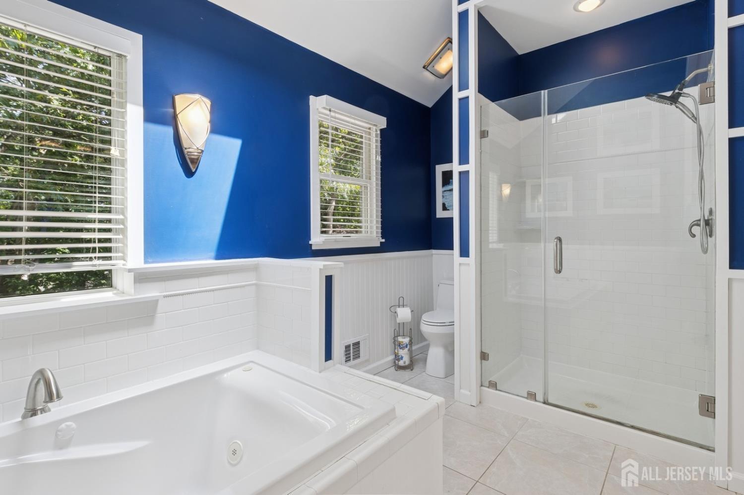 3 Cedar Lane Milltown, NJ 08850 - Photo 36 of 67 a bathroom with a sink and a shower