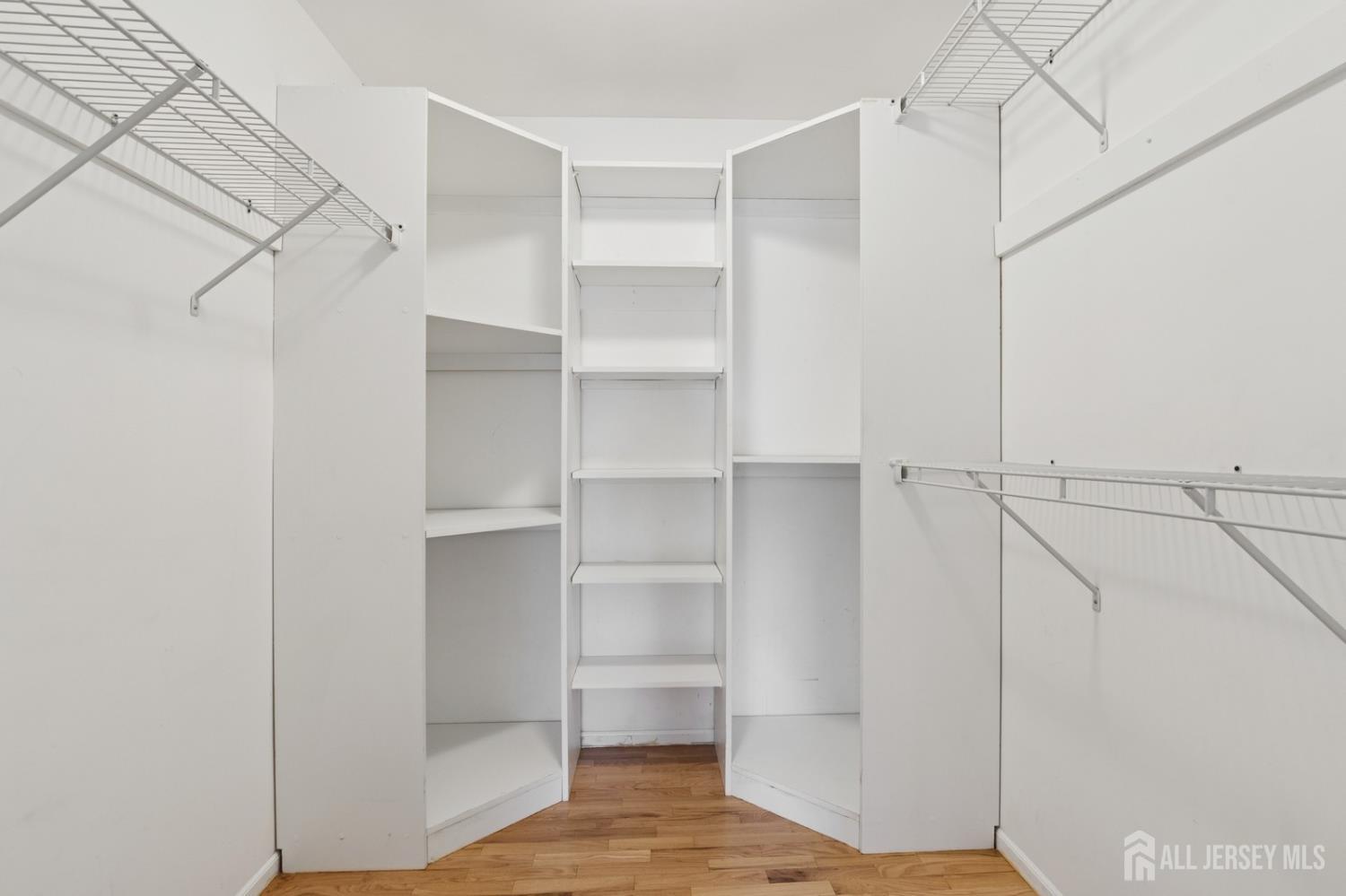 3 Cedar Lane Milltown, NJ 08850 - Photo 37 of 67 a view of walk in closet with empty racks