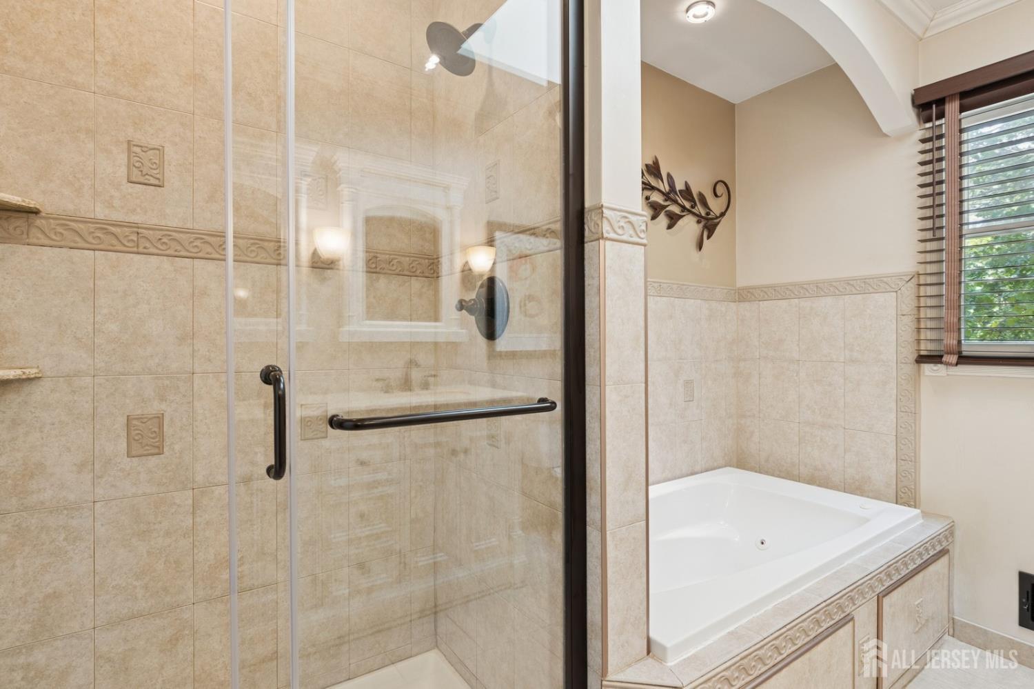 3 Cedar Lane Milltown, NJ 08850 - Photo 44 of 67 a bathroom with a tub a sink and a shower