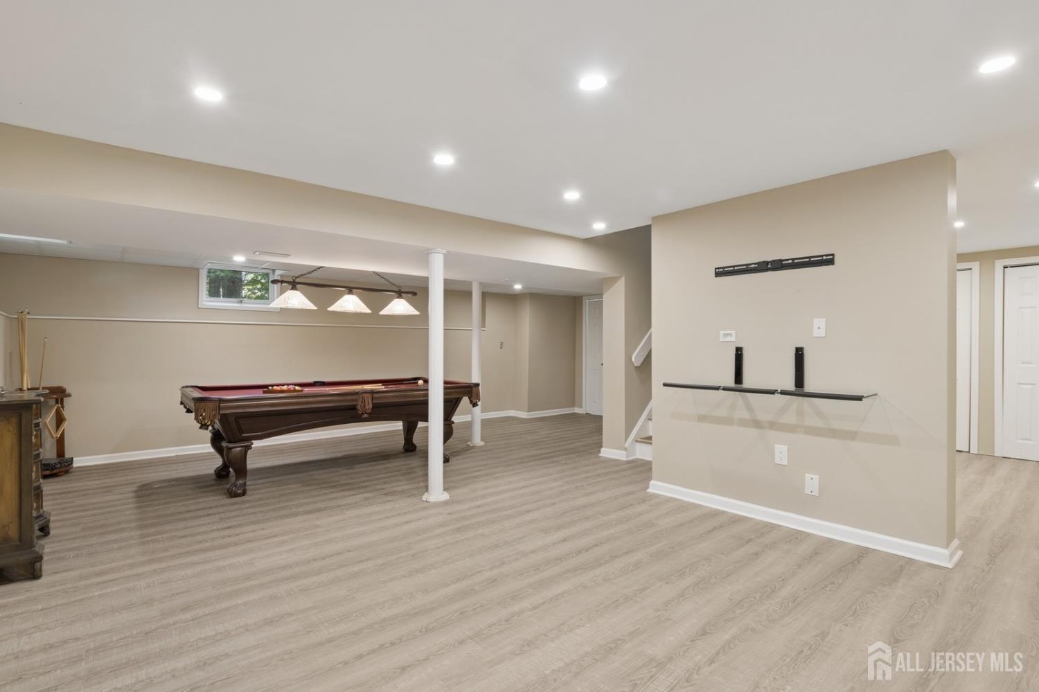 3 Cedar Lane Milltown, NJ 08850 - Photo 46 of 67 a room with wooden floor and furniture