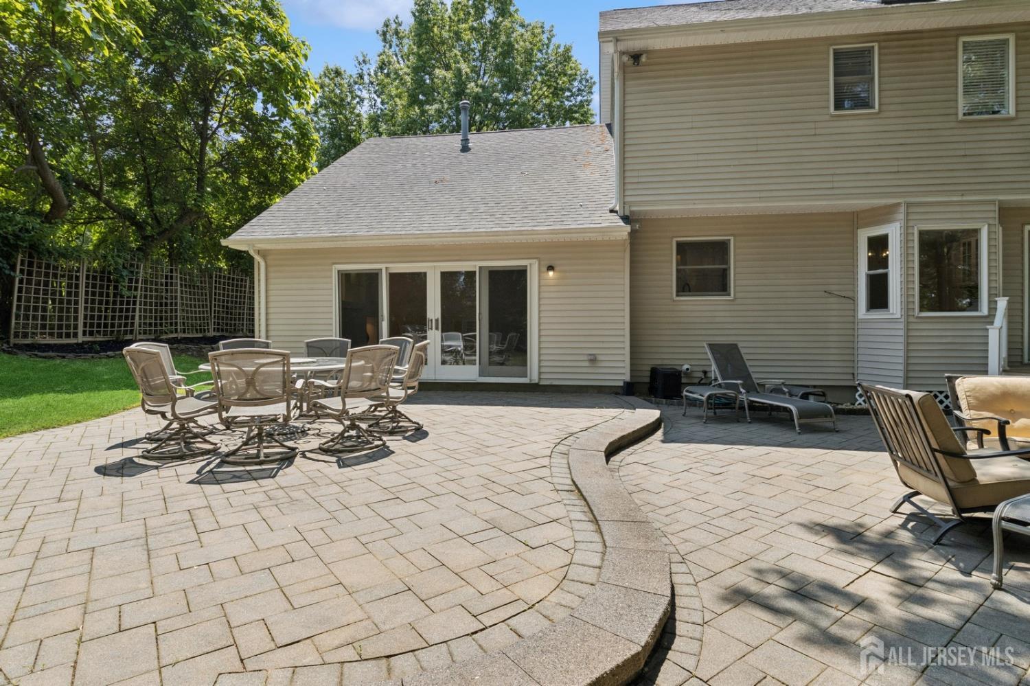 3 Cedar Lane Milltown, NJ 08850 - Photo 50 of 67 a view of a patio with table and chairs with wooden fence and plants