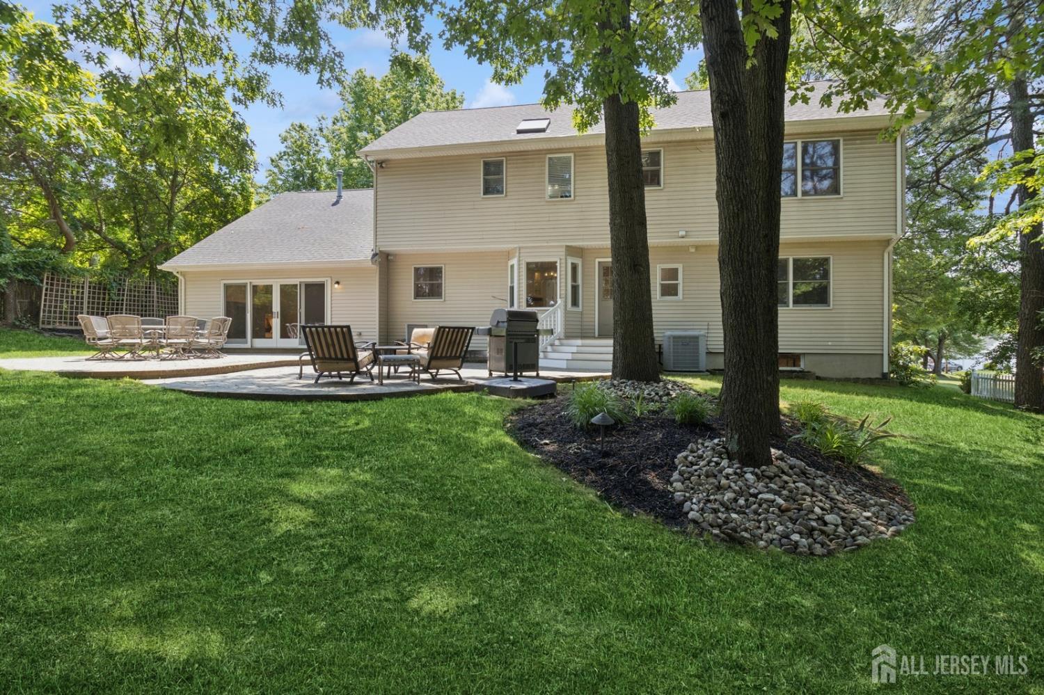 3 Cedar Lane Milltown, NJ 08850 - Photo 54 of 67 a front view of house with yard and green space