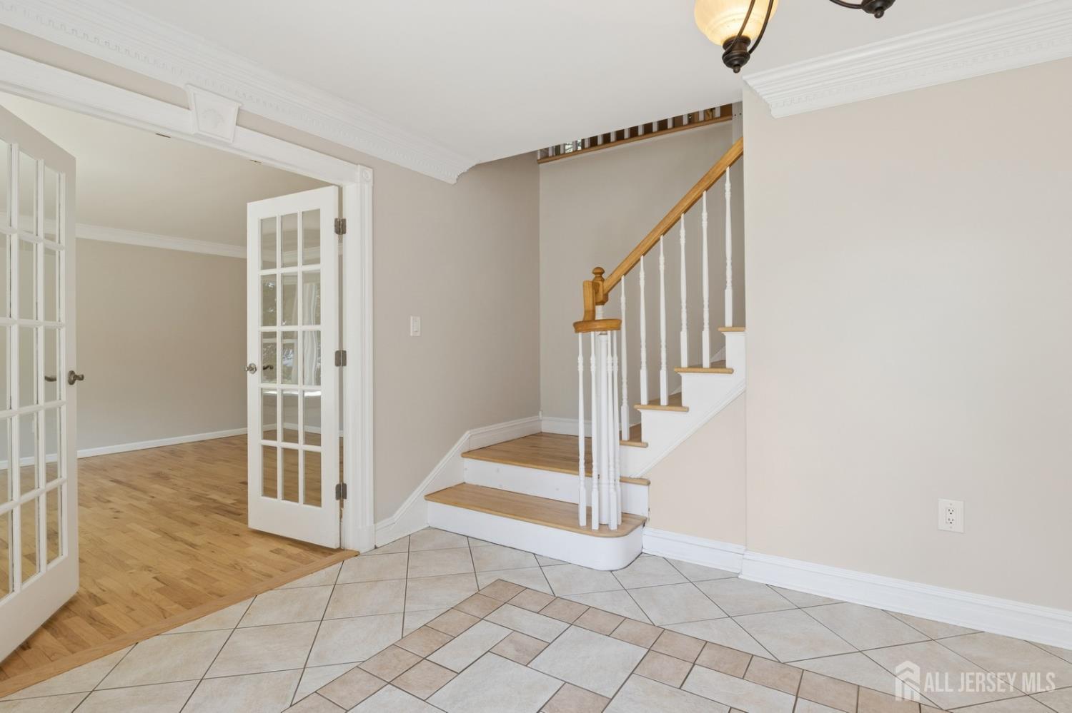 3 Cedar Lane Milltown, NJ 08850 - Photo 8 of 67 a view of entryway with wooden floor and staircase