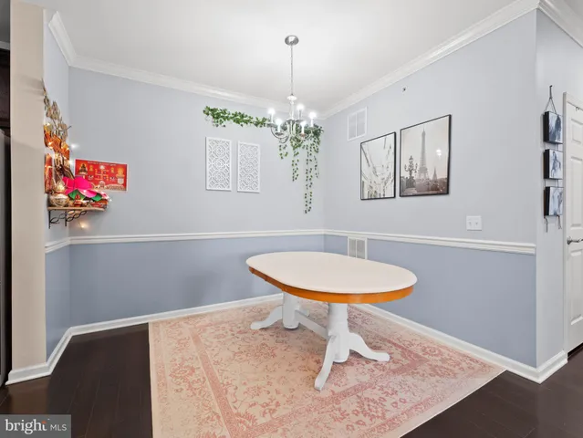 a kitchen with a sink and a refrigerator