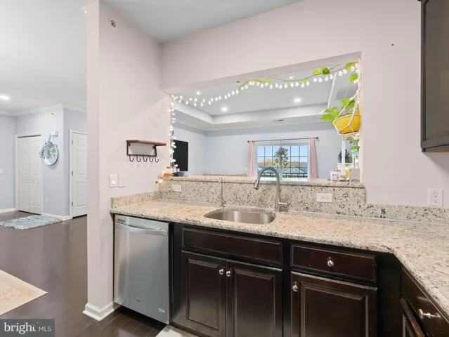 a kitchen with stainless steel appliances a refrigerator and a sink