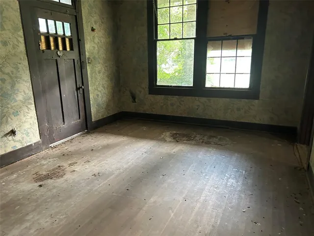 an empty room with windows