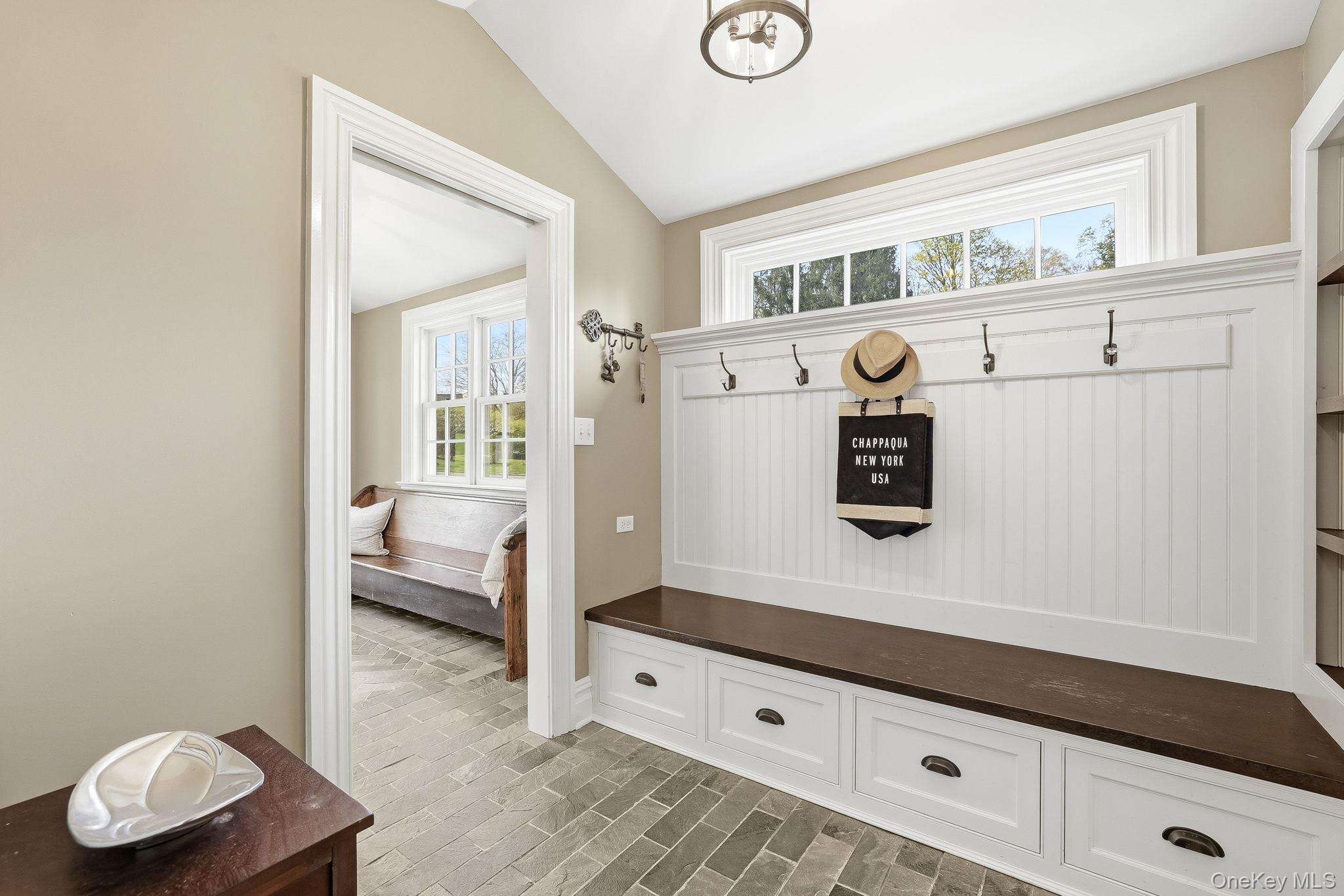 14 Annandale Road Chappaqua, NY 10514 - Photo 22 of 40 a hallway with a bed and a window