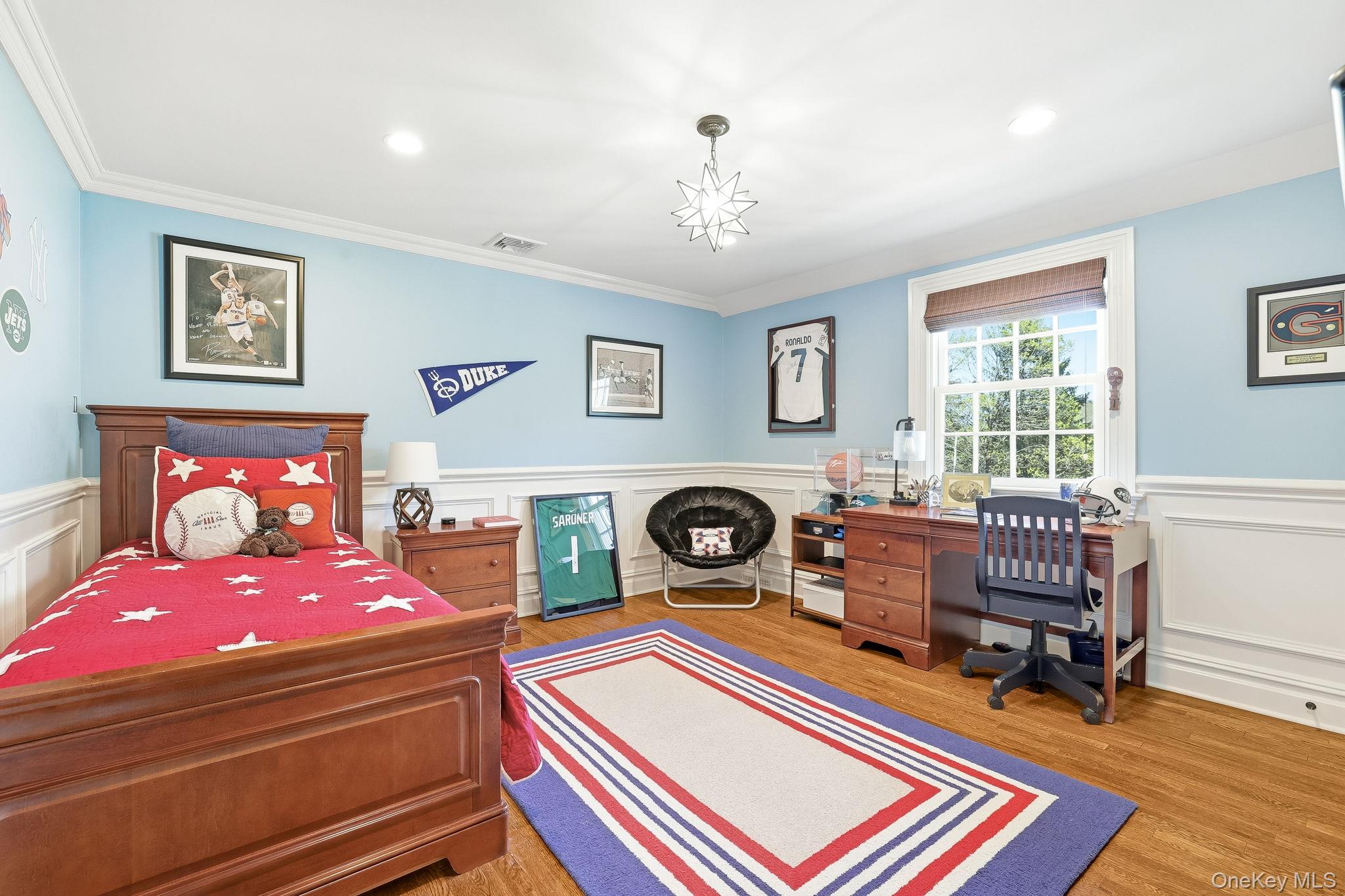 14 Annandale Road Chappaqua, NY 10514 - Photo 28 of 40 a bedroom with a bed and wooden floor