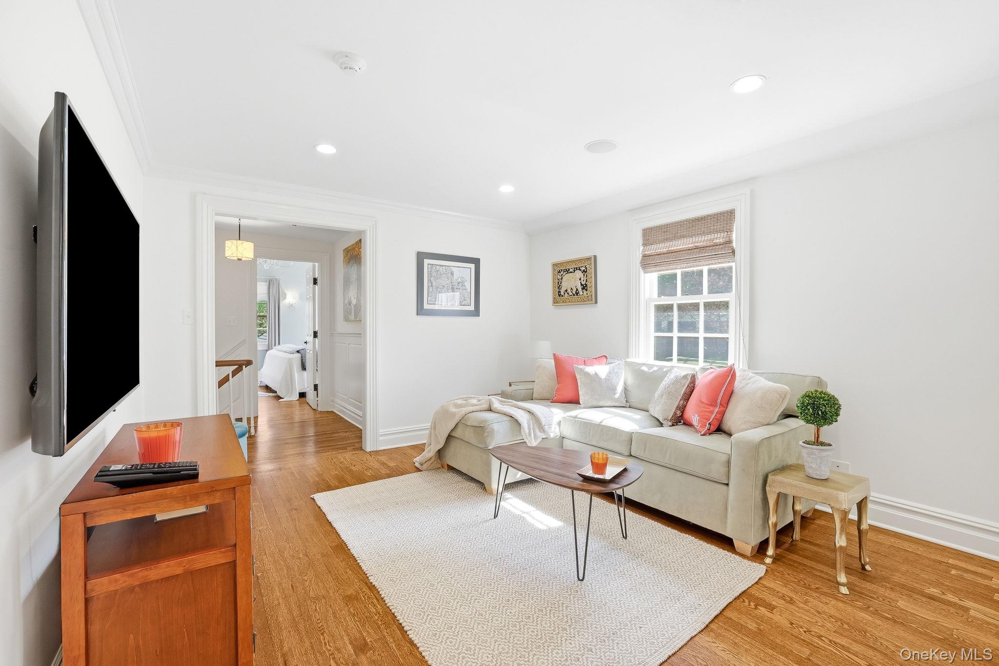 14 Annandale Road Chappaqua, NY 10514 - Photo 30 of 40 a living room with furniture and a flat screen tv