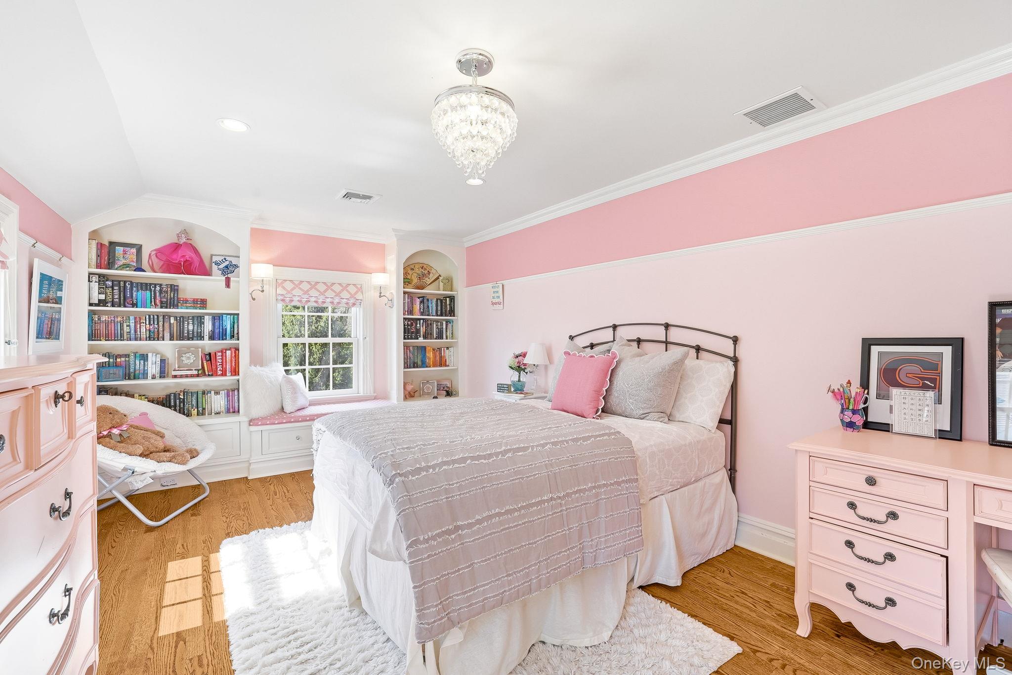 14 Annandale Road Chappaqua, NY 10514 - Photo 31 of 40 a bedroom with a bed and a chandelier