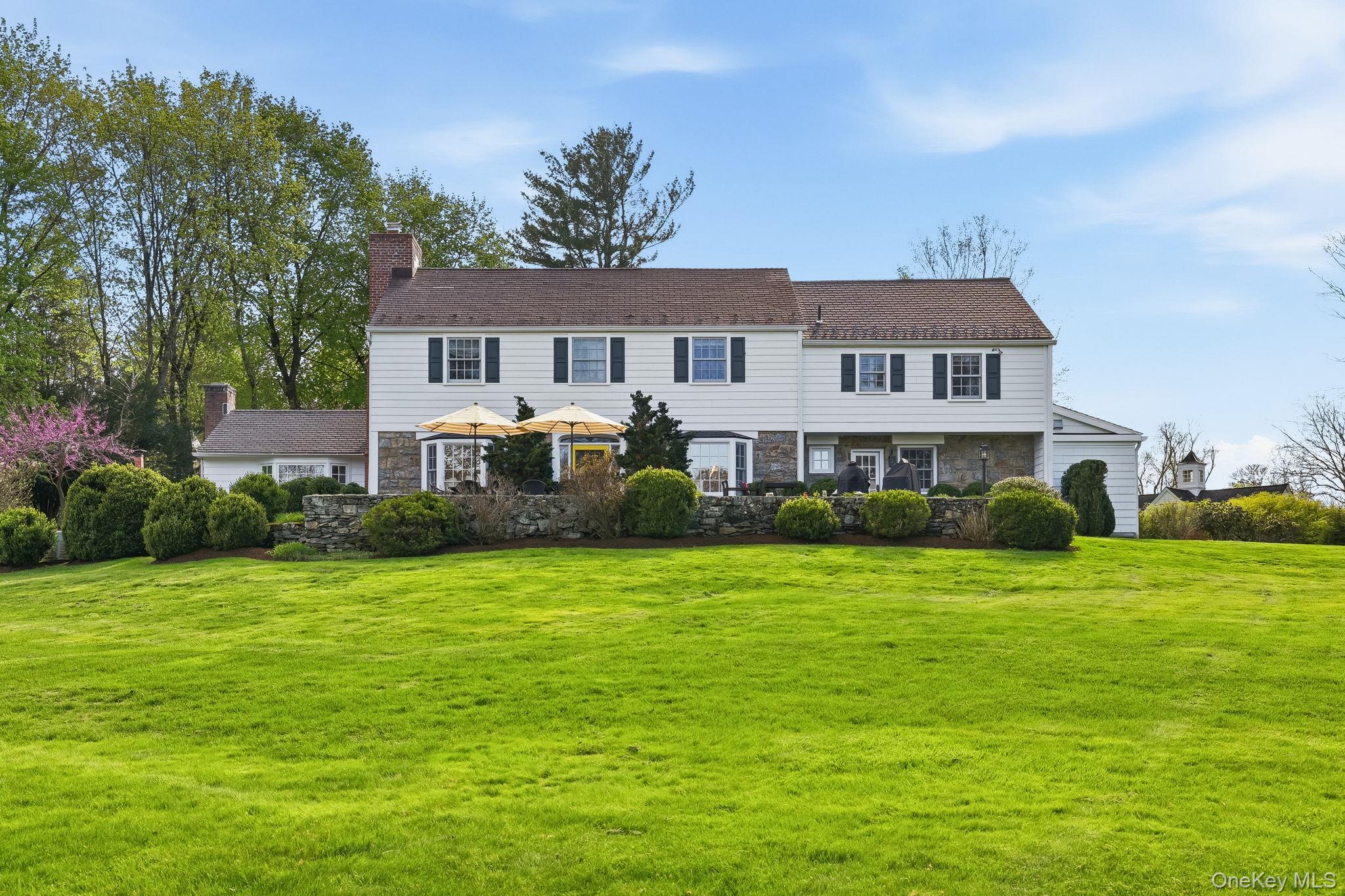 14 Annandale Road Chappaqua, NY 10514 - Photo 35 of 40 a front view of a house with a garden