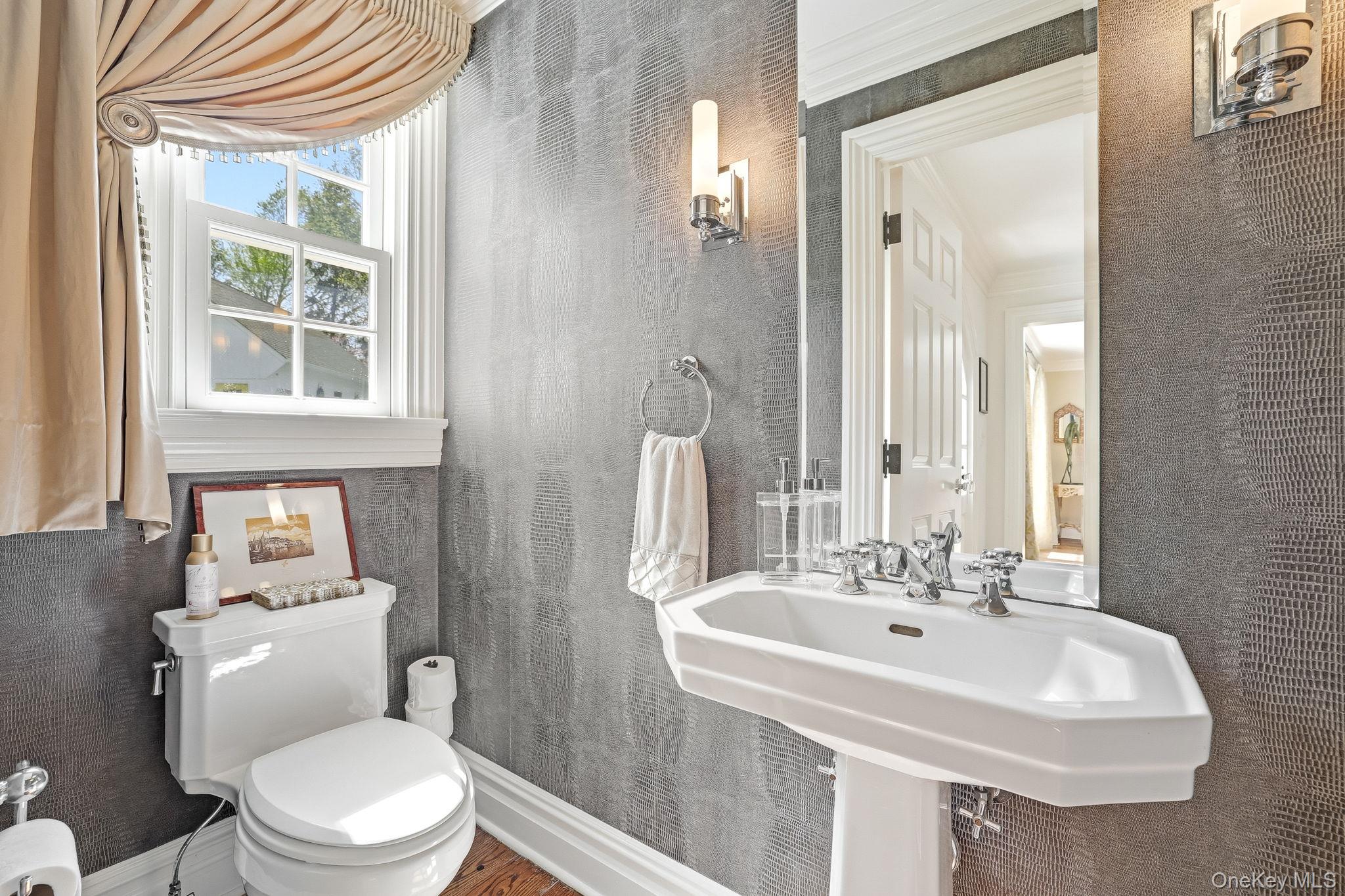 14 Annandale Road Chappaqua, NY 10514 - Photo 7 of 40 a bathroom with a sink a toilet and a mirror