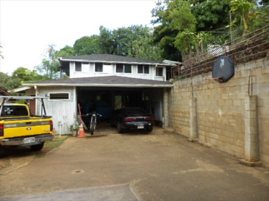 4791 Sadoyama Road Kapaa, HI 96746 - Photo 3 of 8 a view of a house with a patio and a yard