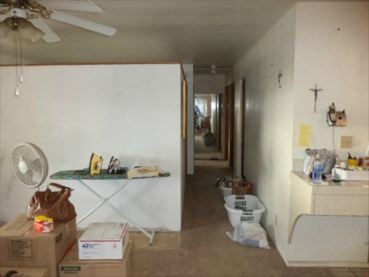 4791 Sadoyama Road Kapaa, HI 96746 - Photo 5 of 8 a living room with furniture and a chandelier