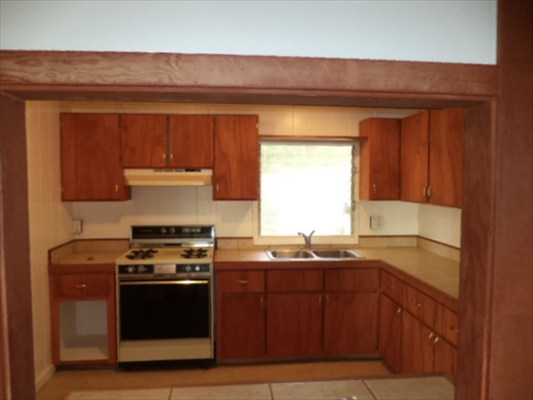 4791 Sadoyama Road Kapaa, HI 96746 - Photo 8 of 8 a kitchen with stainless steel appliances a stove and a microwave