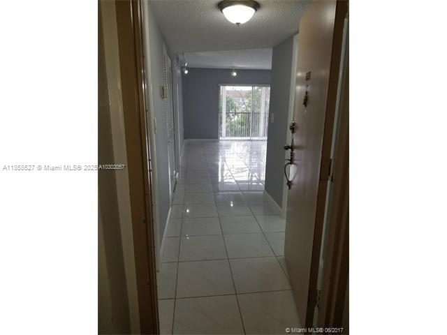 4160 Inverrary Drive, Unit 505 Lauderhill, FL 33319 - Photo 12 of 16 a bathroom with a glass shower door