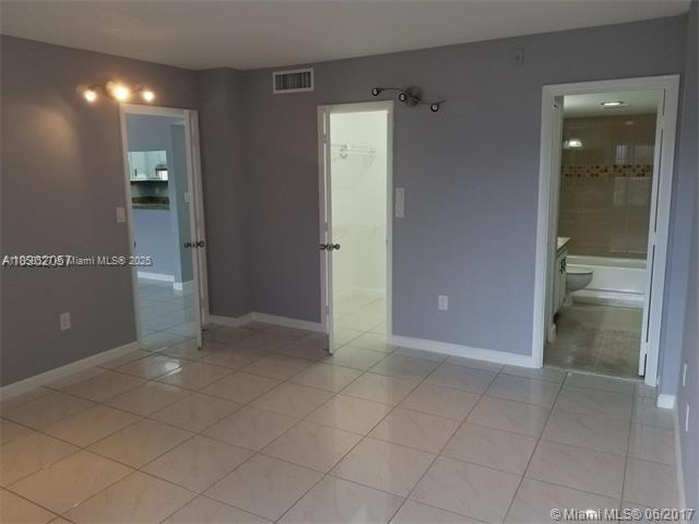 4160 Inverrary Drive, Unit 505 Lauderhill, FL 33319 - Photo 5 of 16 an empty room with an entrance to other room