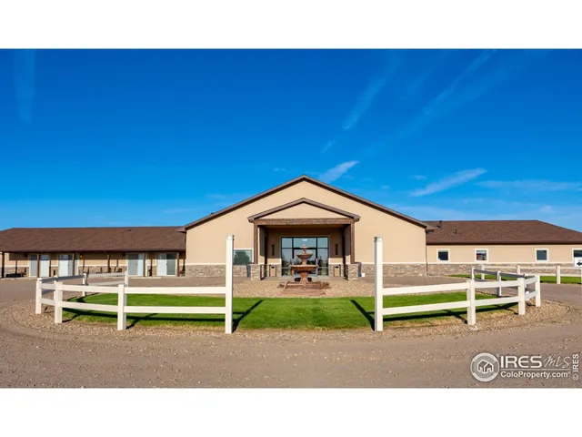 a backyard with a table and chairs