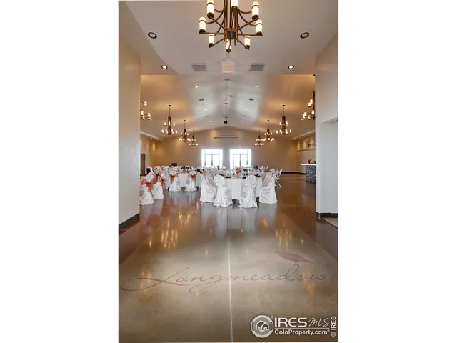 a view of a living room and chandelier