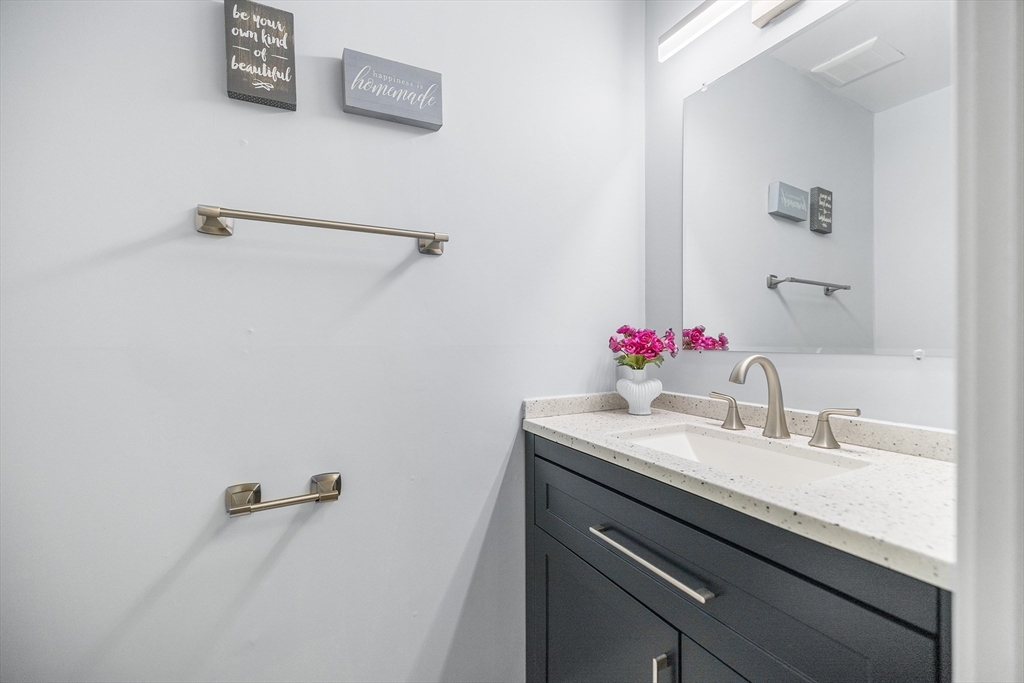 370 Great Road, Unit 8 Acton, MA 01720 - Photo 11 of 27 a bathroom with a sink and a mirror