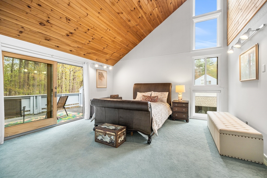 370 Great Road, Unit 8 Acton, MA 01720 - Photo 13 of 27 a bed room with a bed and a chair