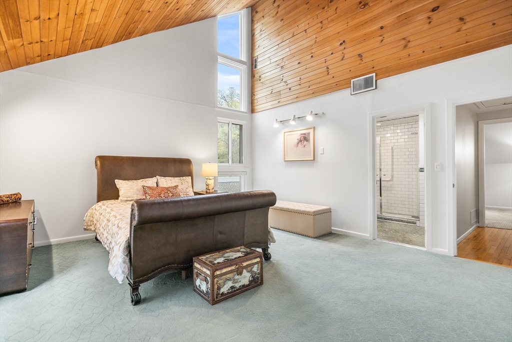 370 Great Road, Unit 8 Acton, MA 01720 - Photo 14 of 27 a bedroom with furniture and a lamp