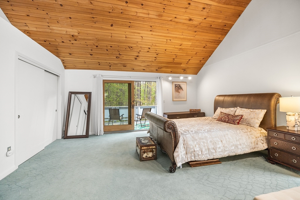 370 Great Road, Unit 8 Acton, MA 01720 - Photo 15 of 27 a bedroom with a bed and a large window