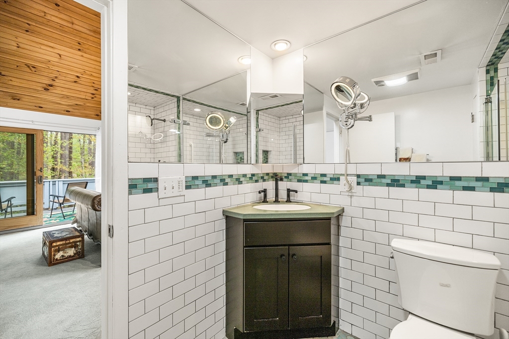 370 Great Road, Unit 8 Acton, MA 01720 - Photo 16 of 27 a bathroom with a sink and a mirror